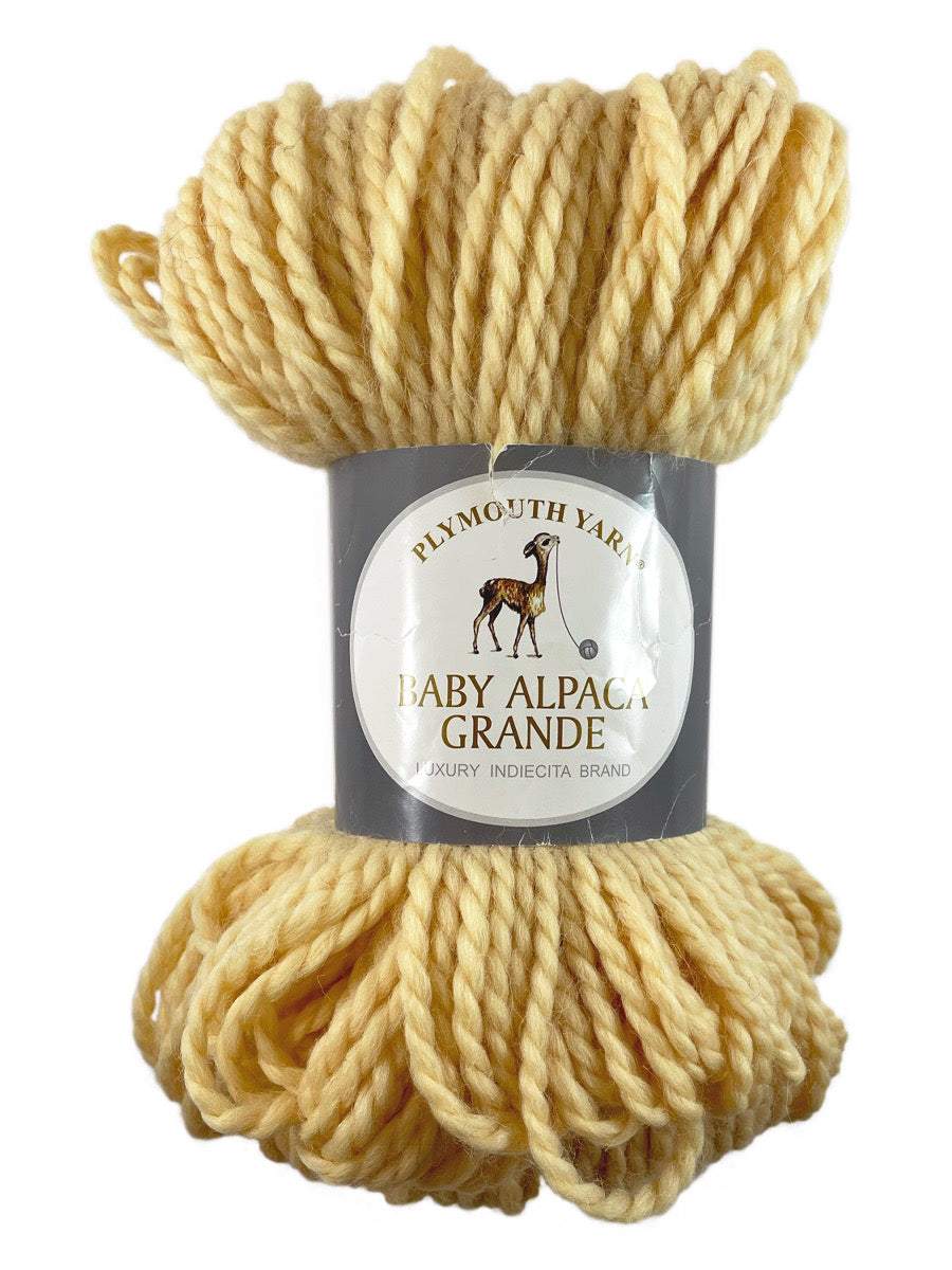 A yellow skein of Plymouth Baby Alpaca Grande yarn