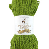 A green skein of Plymouth Baby Alpaca Grande yarn
