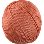 An orange skein of Universal Bamboo Pop yarn