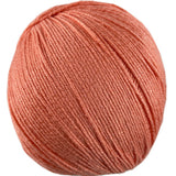 An orange skein of Universal Bamboo Pop yarn