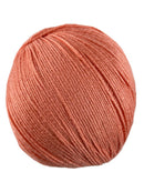 An orange skein of Universal Bamboo Pop yarn