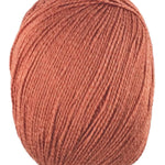 An orange skein of Universal Bamboo Pop yarn