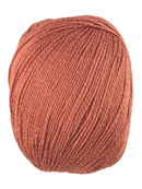 An orange skein of Universal Bamboo Pop yarn