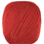 A red skein of Universal Bamboo Pop yarn