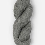 Skein of Blue Sky Fibers Woolstok yarn in the color light heathered grey