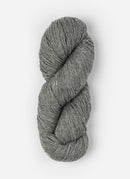 Skein of Blue Sky Fibers Woolstok yarn in the color light heathered grey