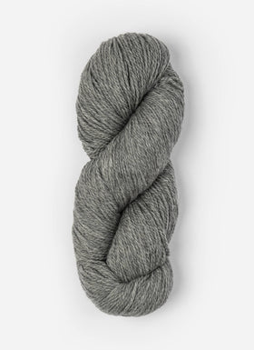 Skein of Blue Sky Fibers Woolstok yarn in the color light heathered grey