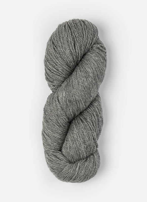 Skein of Blue Sky Fibers Woolstok yarn in the color light heathered grey