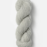 Skein of Blue Sky Fibers Woolstok yarn in the color light grey