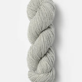 Skein of Blue Sky Fibers Woolstok yarn in the color light grey
