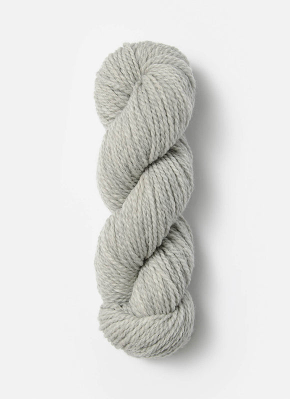 Skein of Blue Sky Fibers Woolstok yarn in the color light grey
