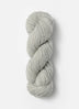 Skein of Blue Sky Fibers Woolstok yarn in the color light grey