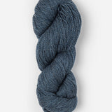 Skein of Blue Sky Fibers Woolstok yarn in the color denim blue