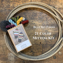 Photo of a Blue Sky Fiber Woolstok yarn Mitten Kit in a lasso on a wooden surface