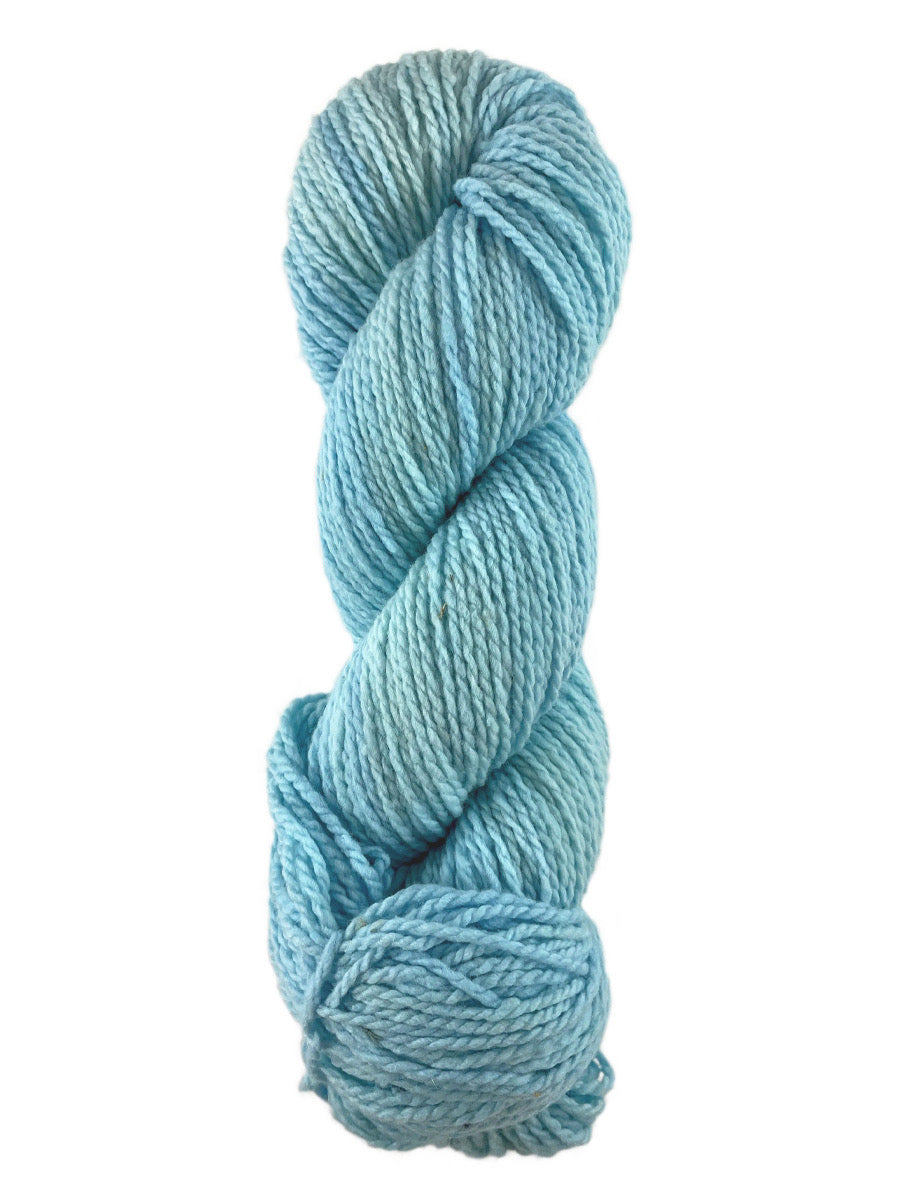 A blue skein of Mountain Meadow Wool Laramie yarn