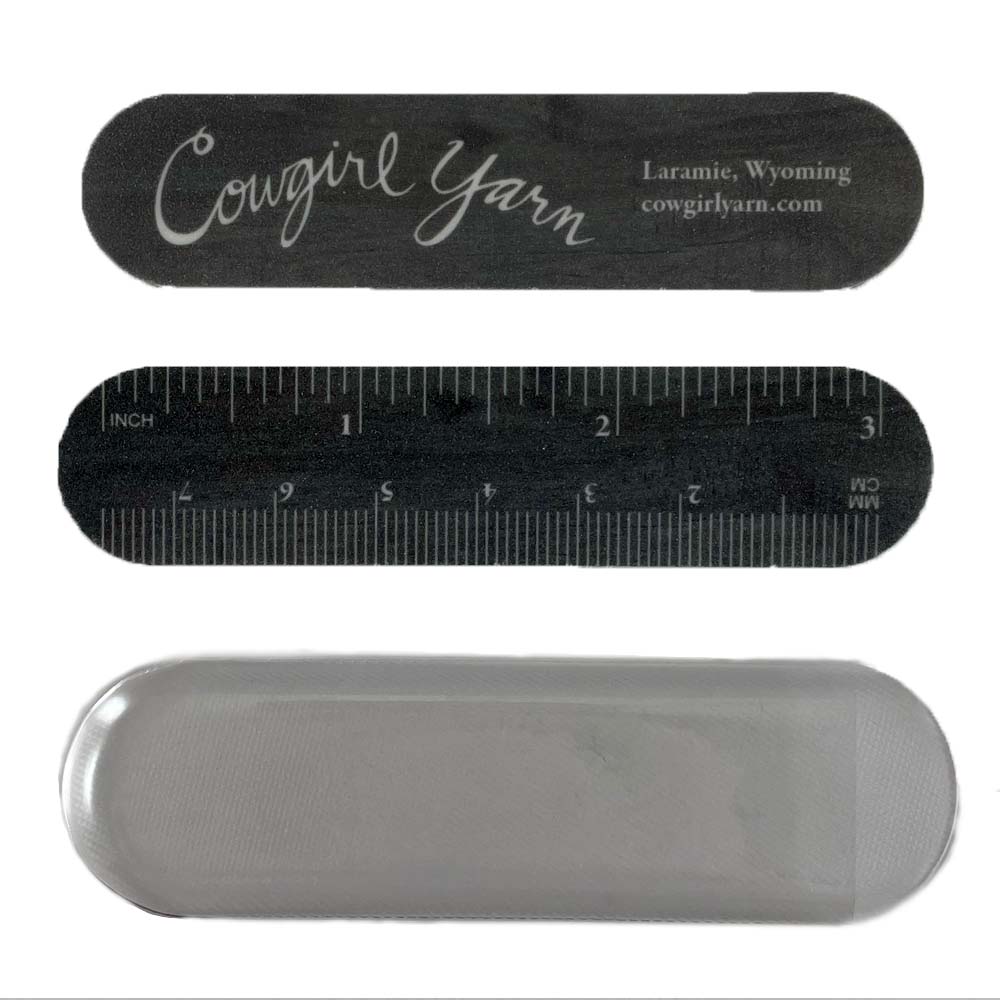 2 nail files with a ruler and cowgirl yarn and a vinyl sleeve