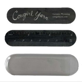 2 nail files with a ruler and cowgirl yarn and a vinyl sleeve