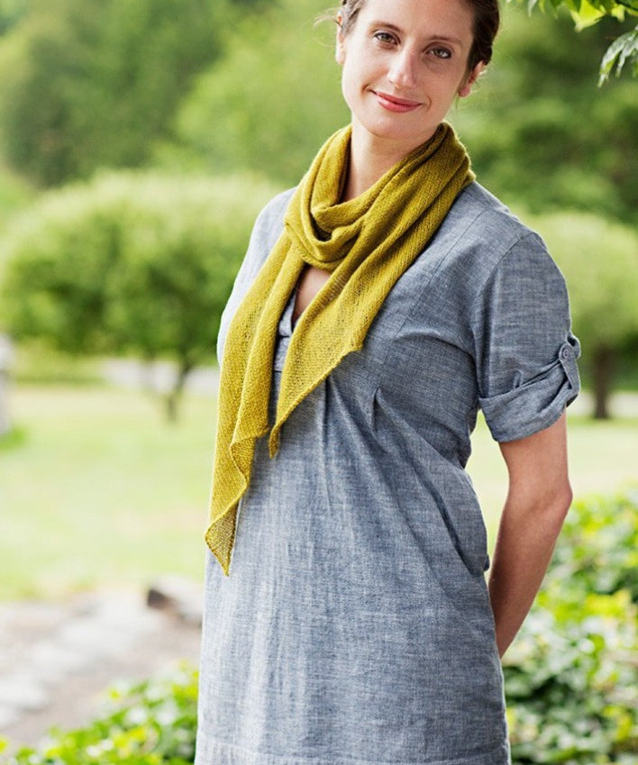 A woman wearing a knitted scarf