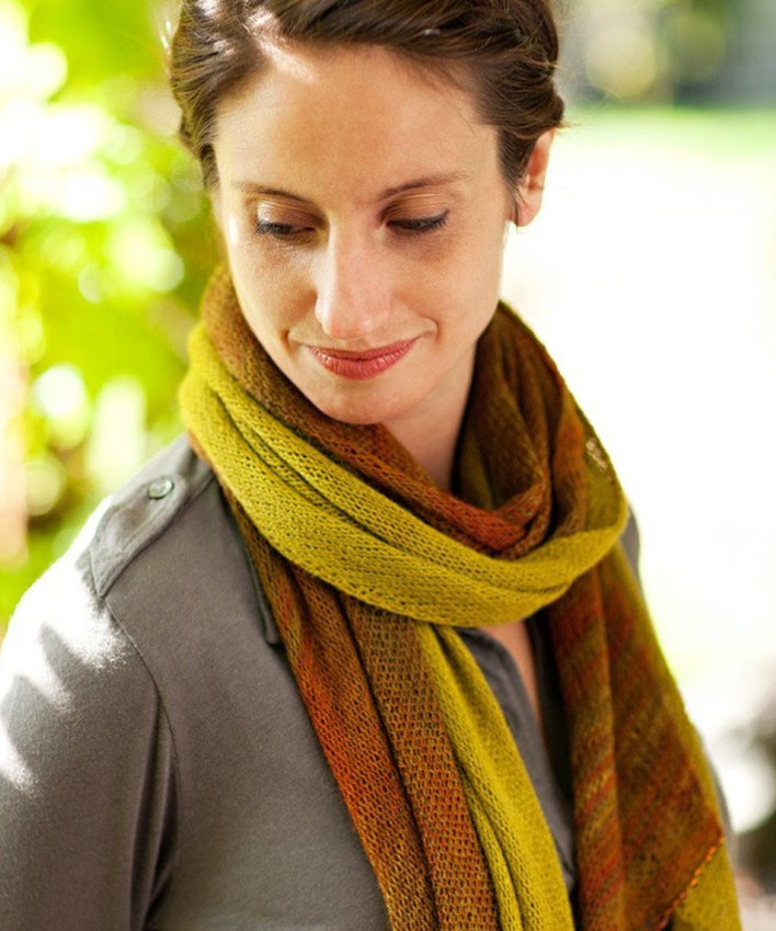 A woman wearing a knitted scarf