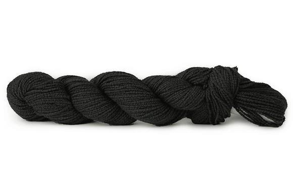 A photo of a black hank of CoBaSi sock yarn.