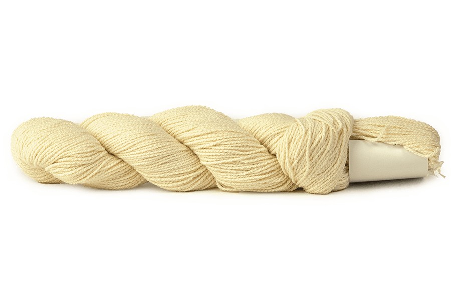 A photo of a cream colored hank of CoBaSi sock yarn.