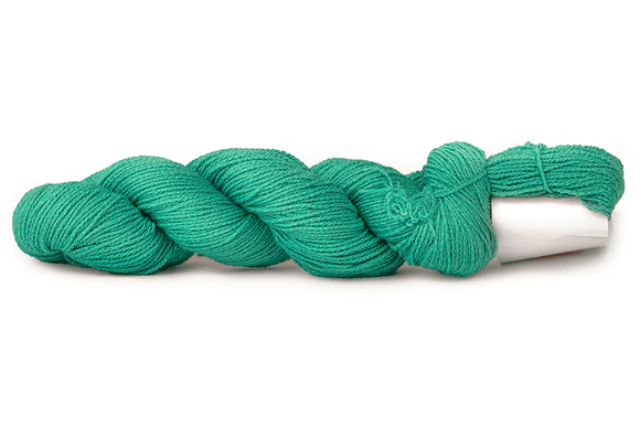 A photo of a deep turquoise hank of CoBaSi sock yarn.