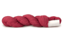 A photo of a raspberry colored hank of CoBaSi sock yarn.