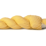 A photo of a butter colored hank of CoBaSi sock yarn.