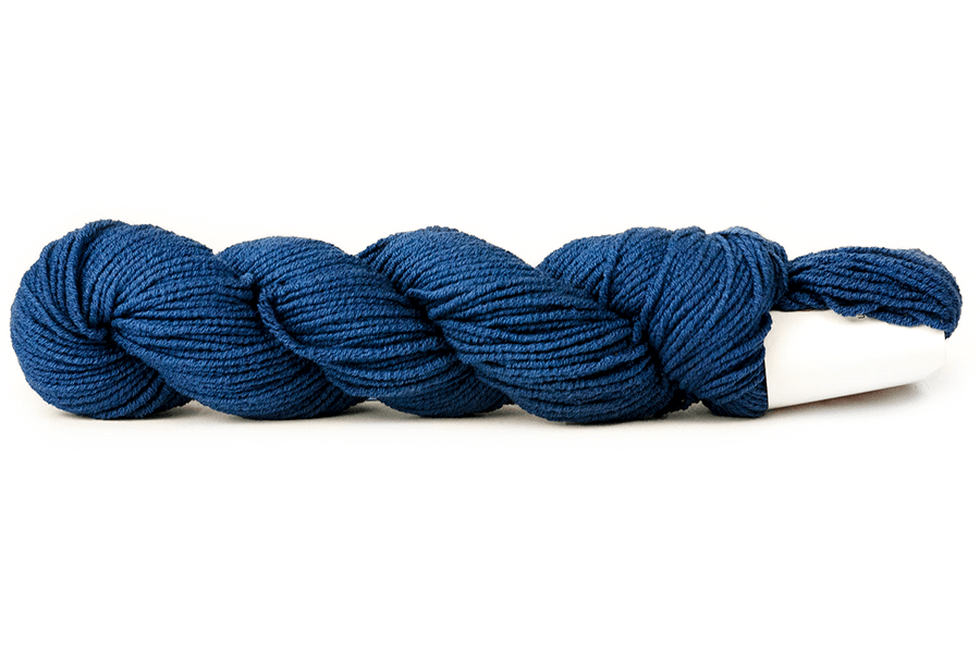 A photo of a blue hank of CoBaSi sock yarn.