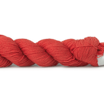 A photo of a salmon colored hank of CoBaSi sock yarn.