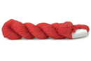 A photo of a salmon colored hank of CoBaSi sock yarn.