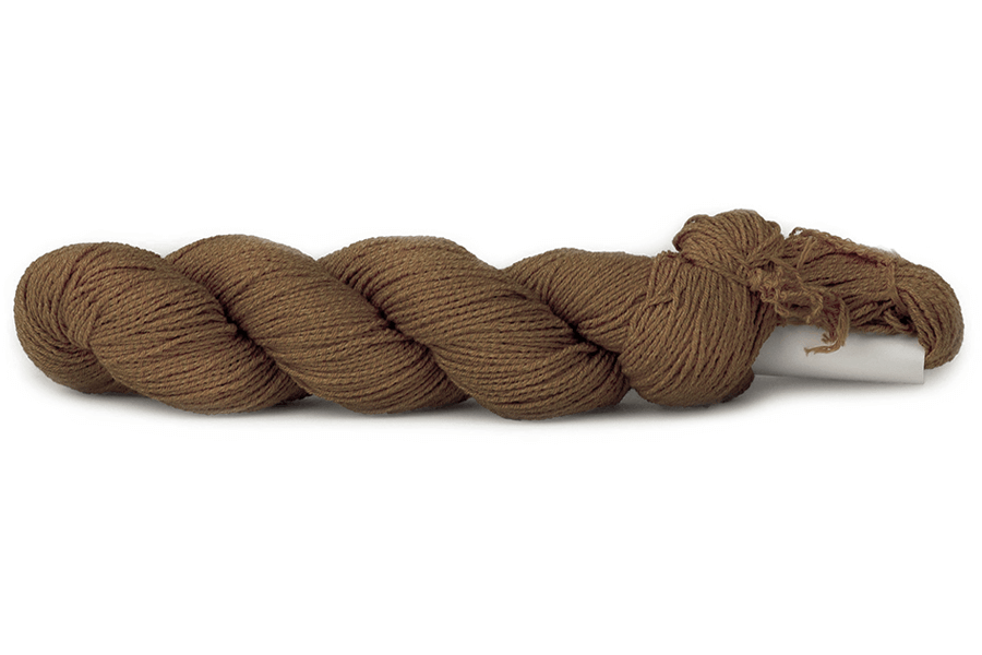 A photo of a light brown hank of CoBaSi sock yarn.