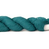 A photo of a teal hank of CoBaSi sock yarn.