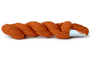 A photo of a carrot colored hank of CoBaSi sock yarn.