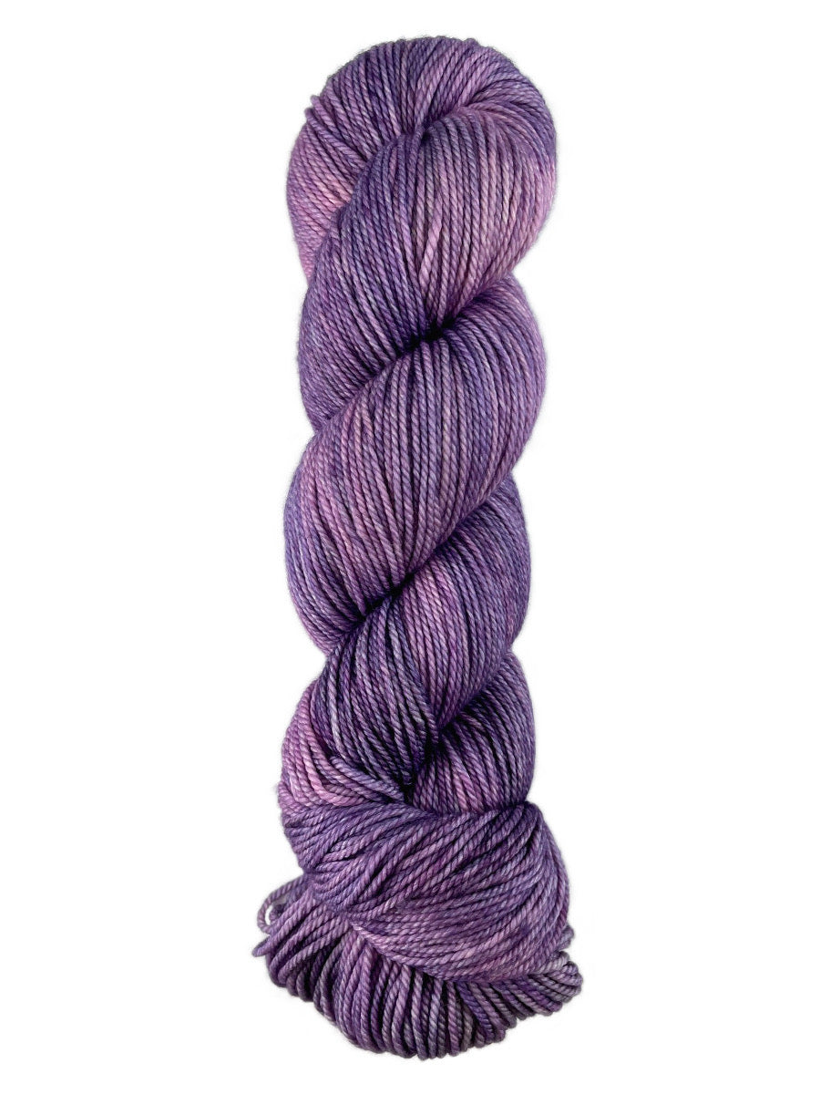 A purple skein of Western Sky Knits Merino 17 DK yarn