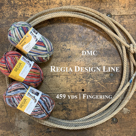 A photo of three skeins of colorful Regia yarn in a lasso on a wooden surface