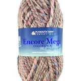 A taupe pink blue skein of Plymouth Yarn Encore Mega Colorspun yarn