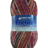 A red and black skein of Plymouth Encore Colorspun yarn