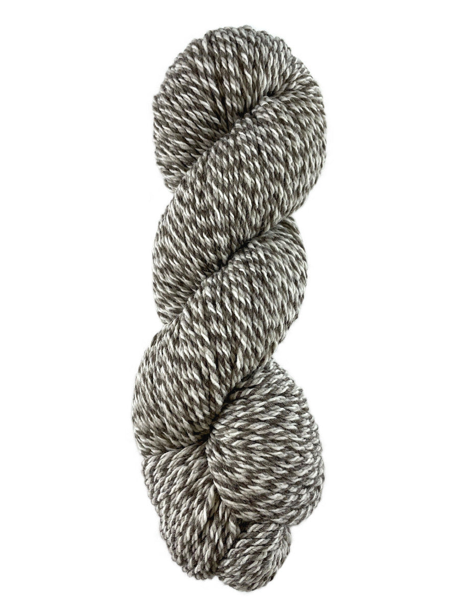 A natural marled skein of Mountain Meadow Wool Cora yarn