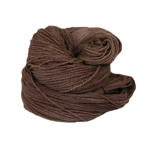 A brown hank of the Mountain Meadow Wool Saratoga yarn collection