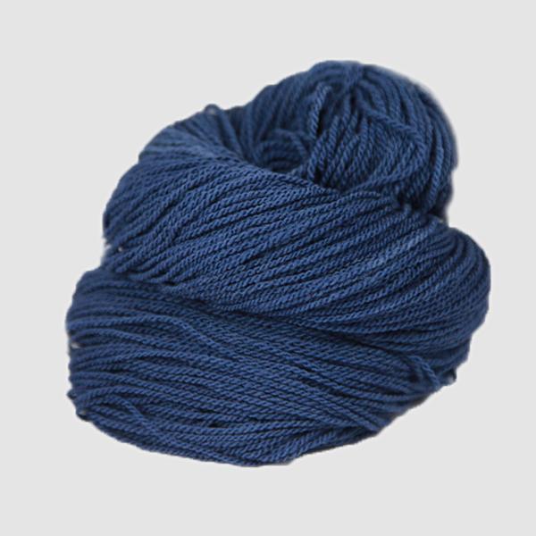 A navy blue hank of the Mountain Meadow Wool Saratoga yarn collection