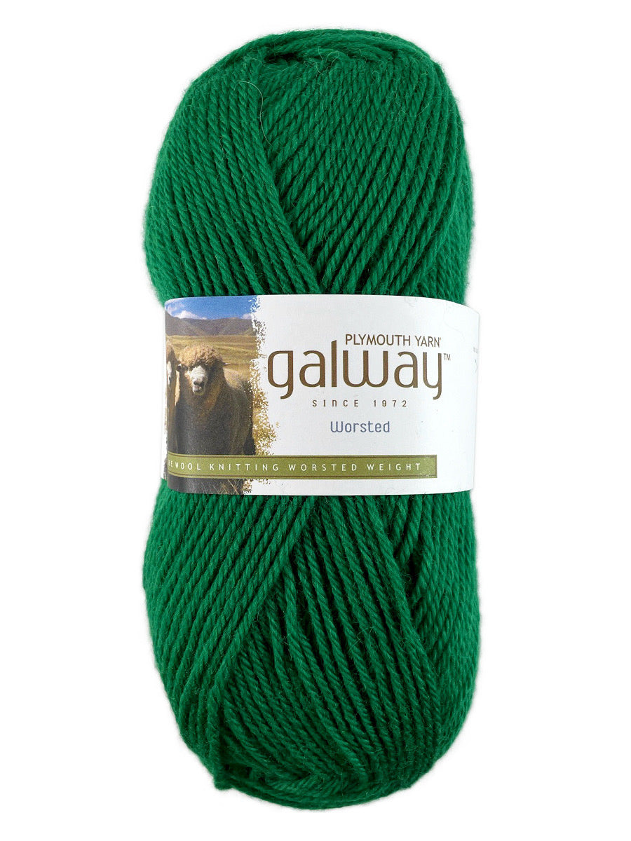 A green skein of Plymouth Yarn Galway yarn
