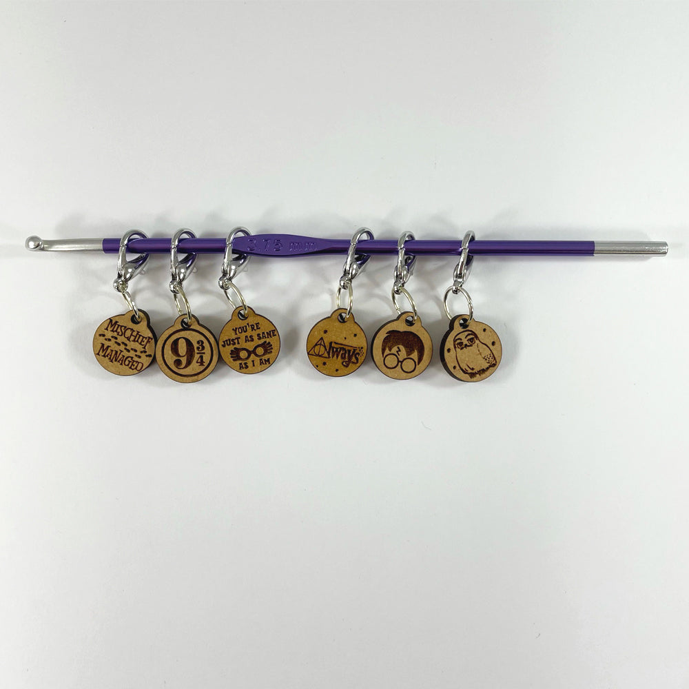 A photo of stitch markers related to Harry Potter.
