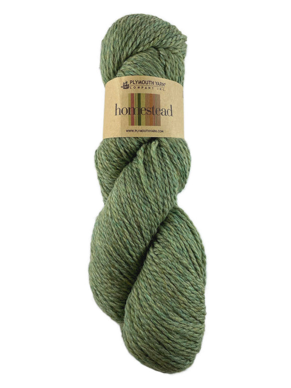 A green skein of Plymouth Homestead yarn