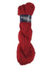 A red skein of Plymouth Fantasy Naturale yarn