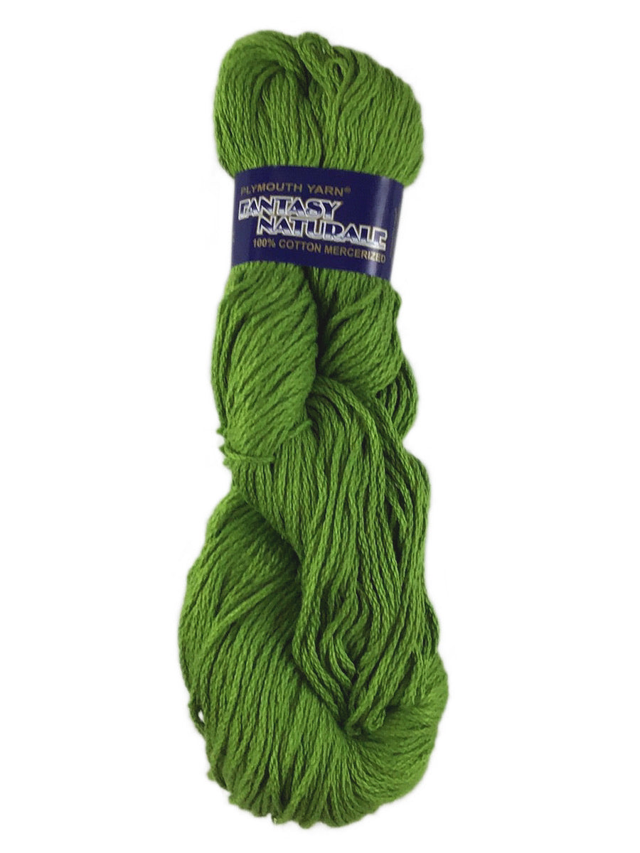 A green skein of Plymouth Fantasy Naturale yarn