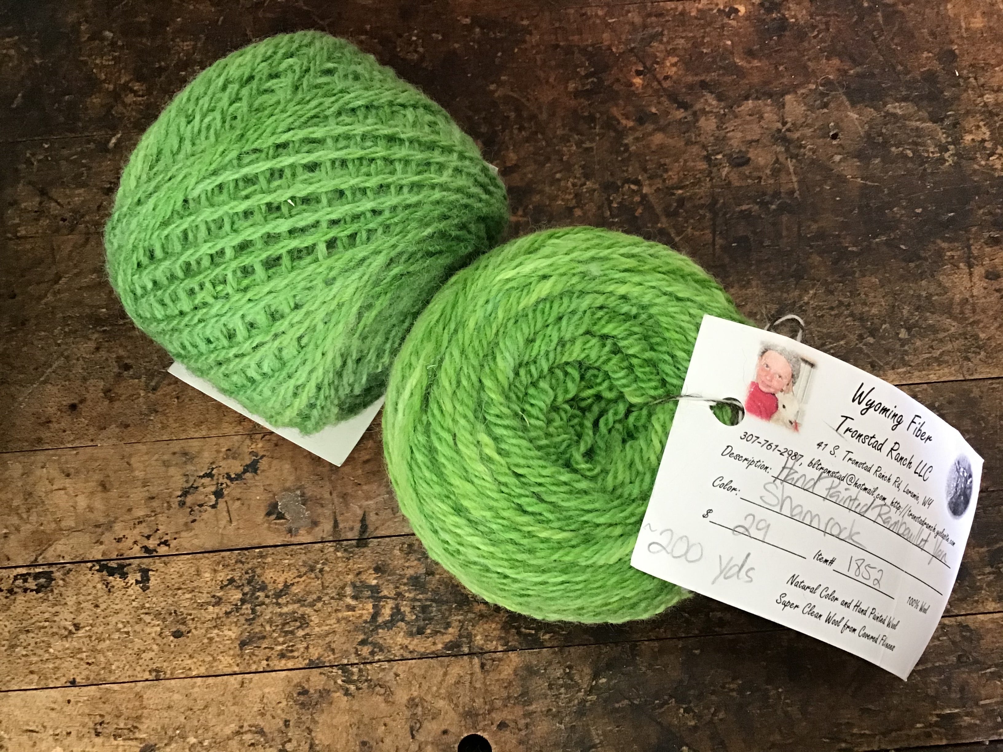 Photo of two balls of green Tronstad yarn