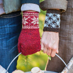 Two people wearing colorwork mitten and cuff