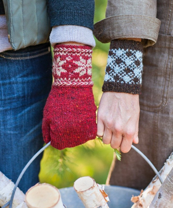 Two people wearing colorwork mitten and cuff