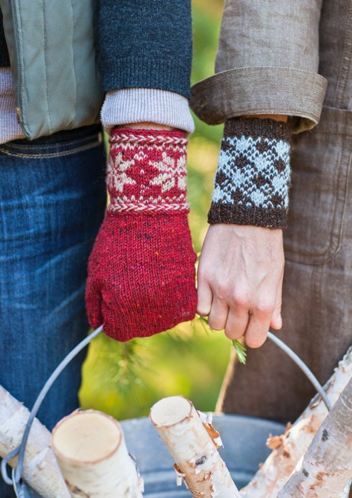 Two people wearing colorwork mitten and cuff